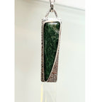 Oxidized sterling silver pendant with forest green stone - on white, glass like background