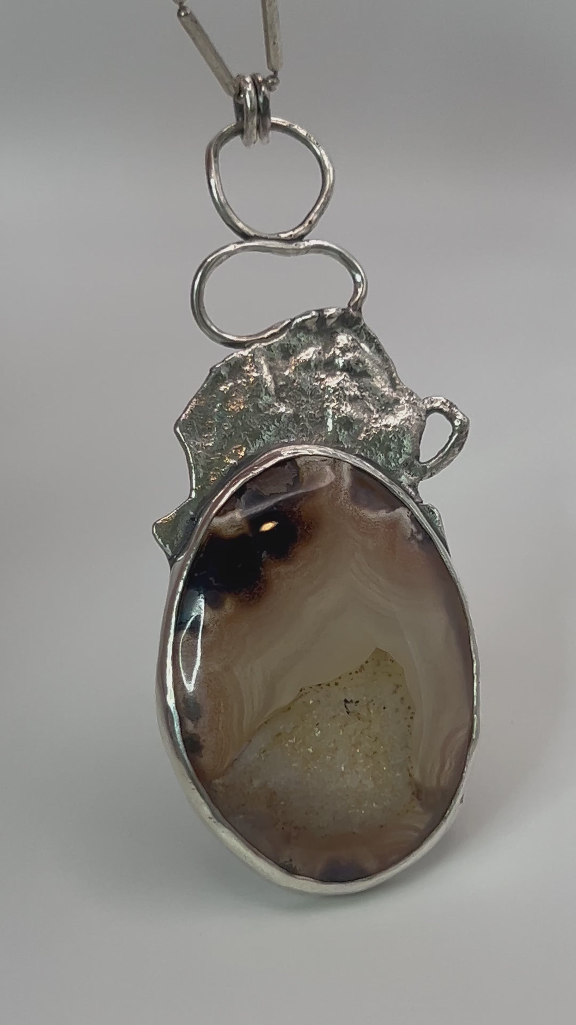 Live view of druzy agate statement pendant open-back design with sterling silver accent