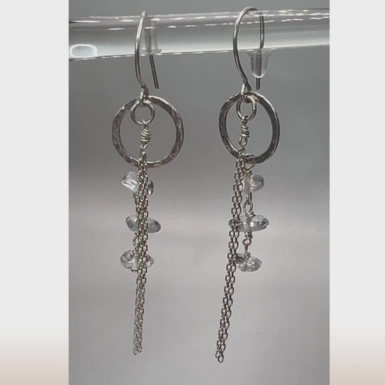 Live view of clear quartz drop earrings showing light-reflecting crystals and silver chain