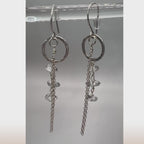 Live view of clear quartz drop earrings showing light-reflecting crystals and silver chain
